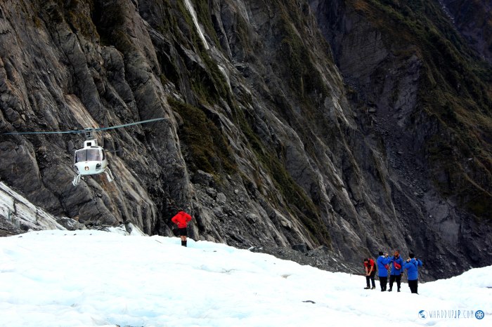 The helicopter departs the glacier