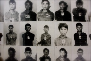 the faces of the dead stare from the walls