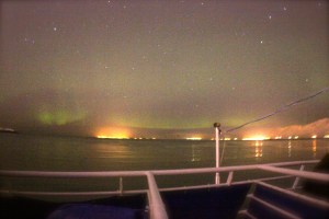 The Northern Lights above the mountains surrounding Reykjavik